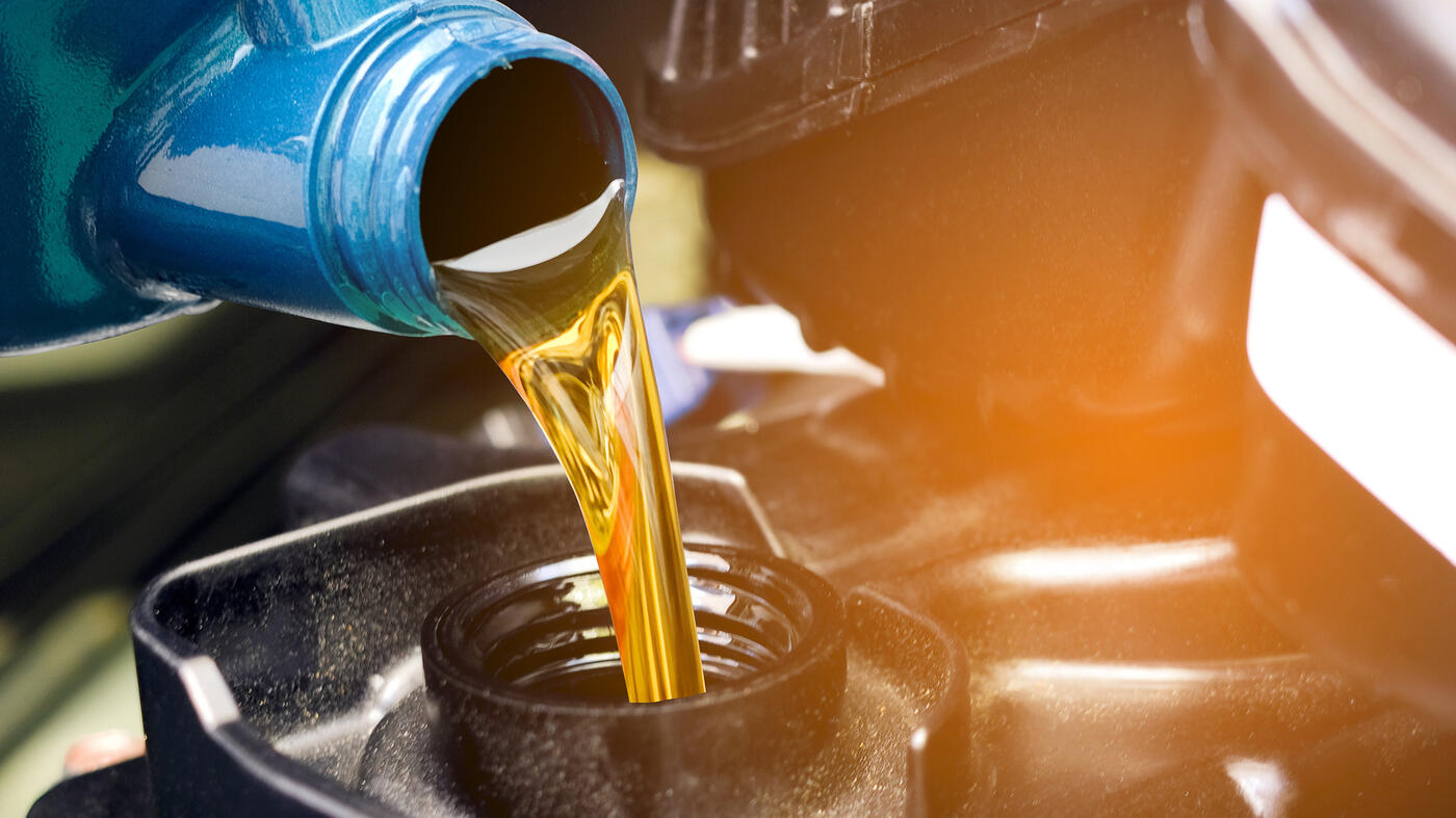 motor oil that is pouring into a truck