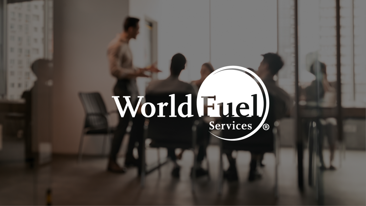 background image of an office team with world fuel services logo upfront